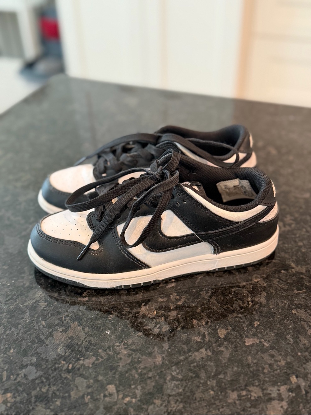 Nike Kids Black and White Low-Top Sneakers with Swoosh
